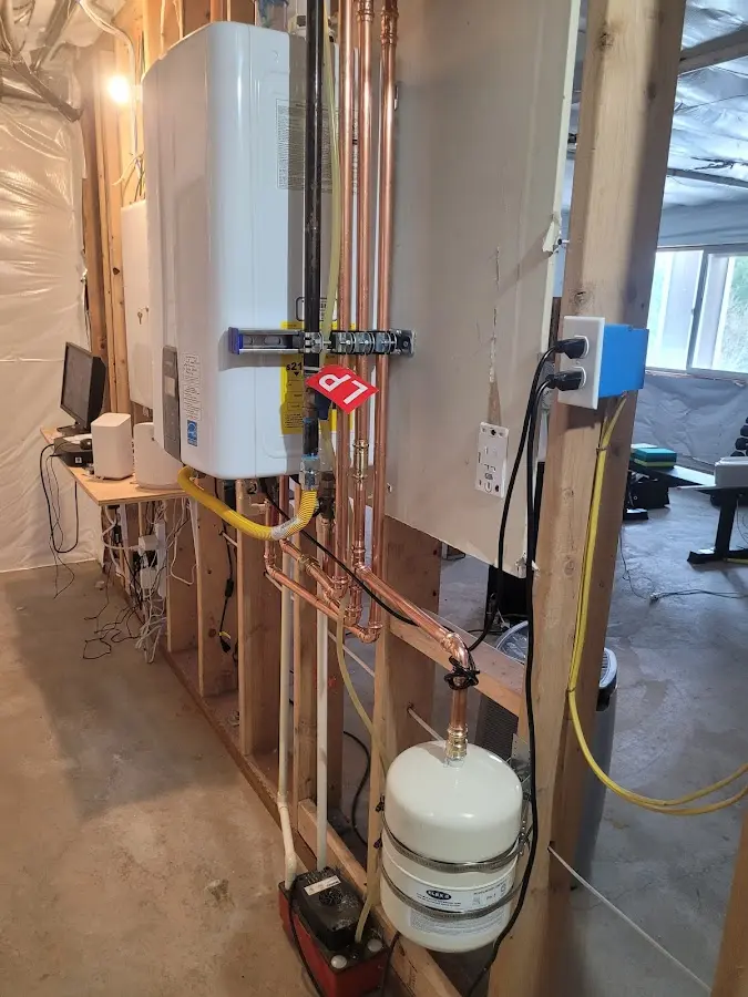 Licensed plumber repairing a kitchen sink in Haddam